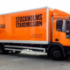 Lastbil till Stockholms Stadsmission folierad i orange färg
